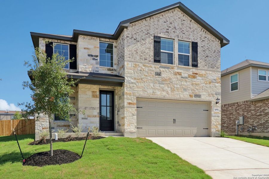 Front exterior of a new home in Thomas Pond, San Antonio, TX, highlighting curb appeal (Image 25). Front exterior of a new home in Thomas Pond, San Antonio, TX, highlighting curb appeal (Image 25).