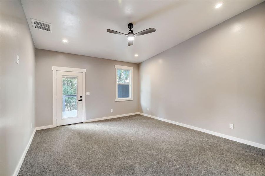 Great sized primary bedroom with door to back deck.