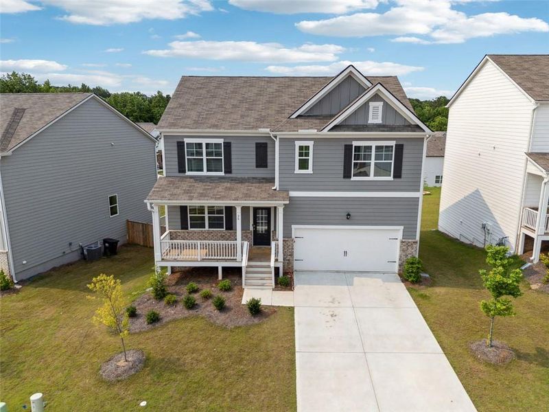 Front exterior of a new home in , Dallas, GA, highlighting curb appeal (Image 1).