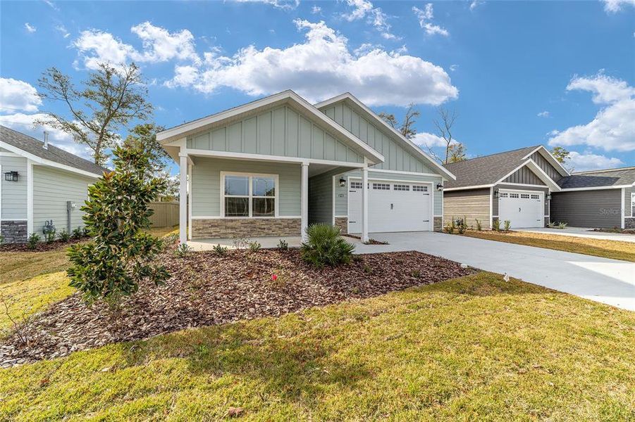 Front exterior of a new home in Grand Oaks, Gainesville, FL, highlighting curb appeal (Image 1). Front exterior of a new home in Grand Oaks, Gainesville, FL, highlighting curb appeal (Image 1).