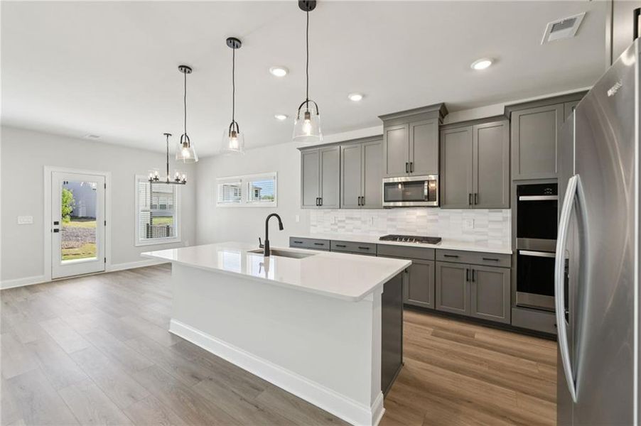 Furnished interior view inside a new home in Vines at Mill Creek - Estate Series, Braselton (Image 6).
