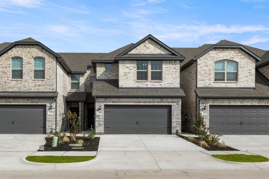 Front exterior of a new home in Main Street Village, Mansfield, TX, highlighting curb appeal (Image 1). Front exterior of a new home in Main Street Village, Mansfield, TX, highlighting curb appeal (Image 1).