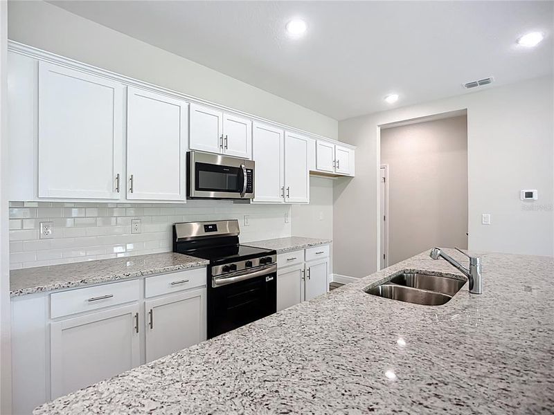 Furnished interior view inside a new home in , North Port (Image 6).