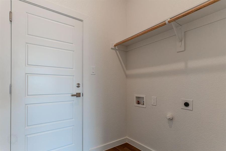 Utility room with washer and dryer hookups