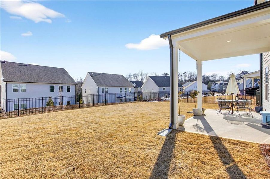 Exterior details and patio area of a home in East Harbor II at Chestatee, Dawsonville (Image 22).