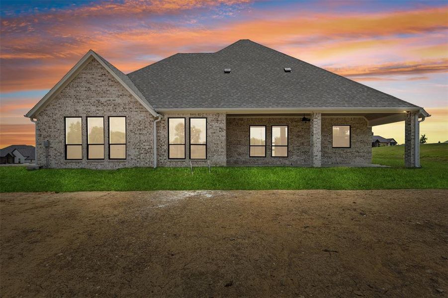 View of front of house featuring a lawn