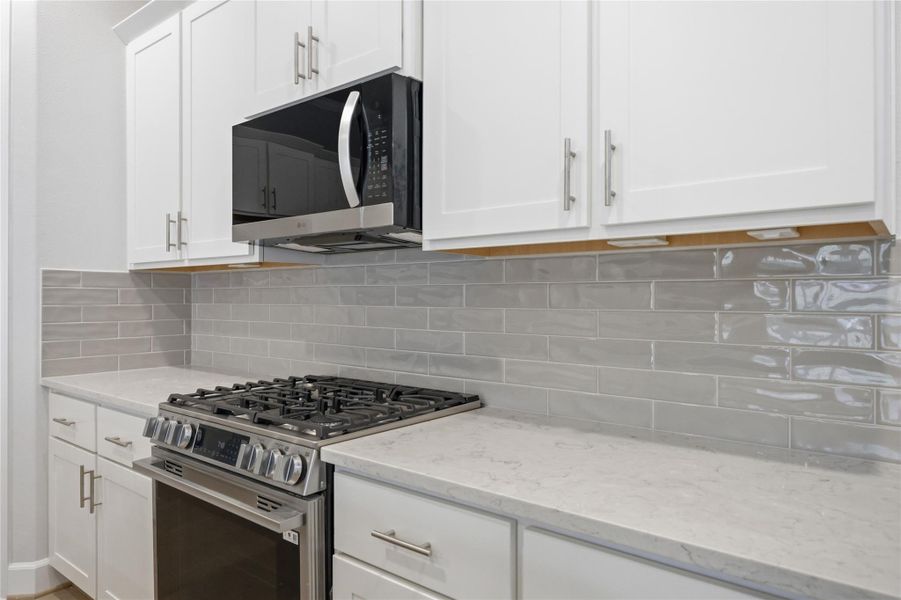 Sophistication Redefined: The kitchen's centerpiece—an elegant island—awaits the glow of your chosen pendant light upgrade, making every moment in the heart of the home shine brighter.