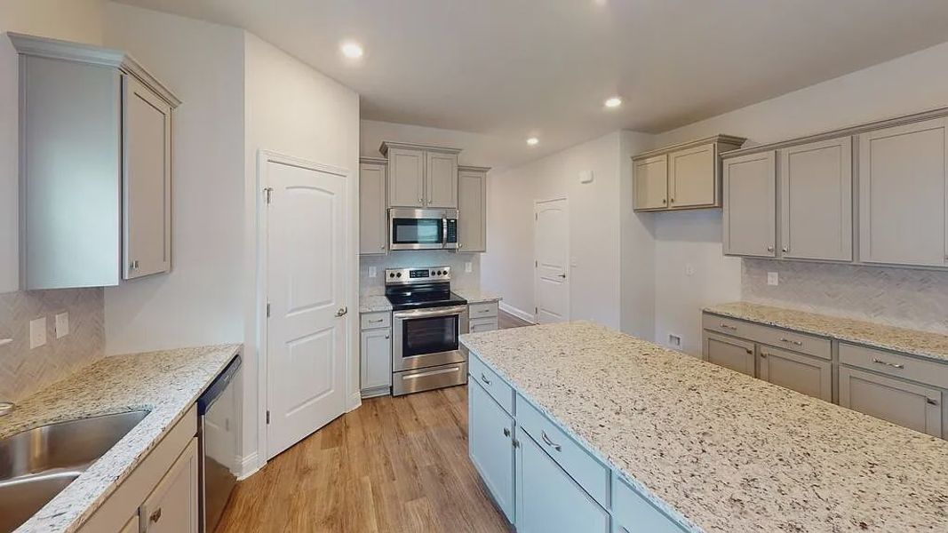 Furnished interior view inside a new home in Mirror Lake at South Harbour, Villa Rica (Image 4).