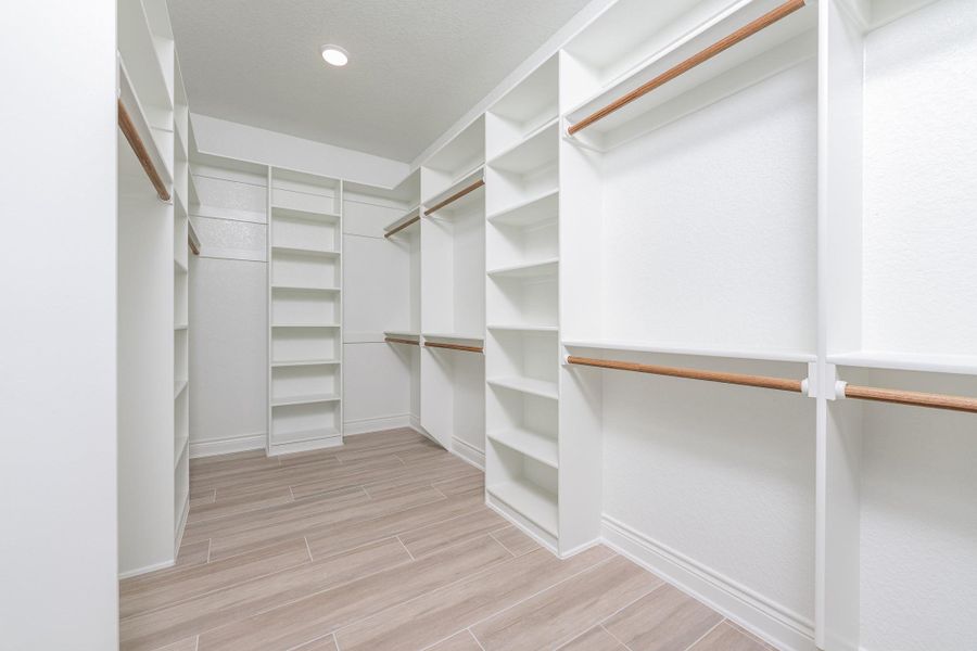 Spacious closet with wood finish floors Spacious closet with wood finish floors