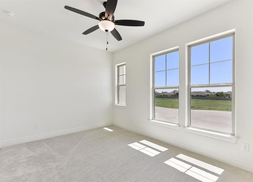 This room features light-colored walls and carpeted flooring