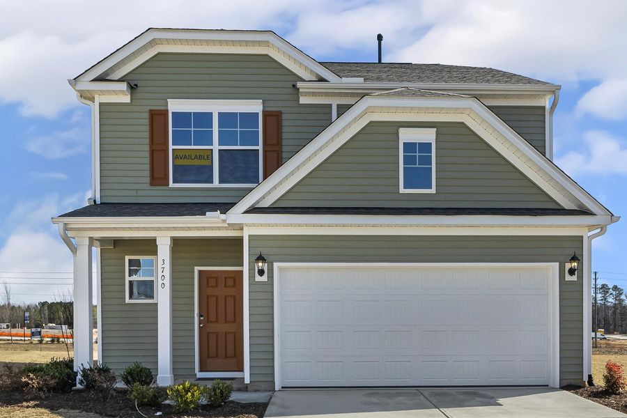 Front exterior of a new home in 1158 Place, Wilson, NC, highlighting curb appeal (Image 1).