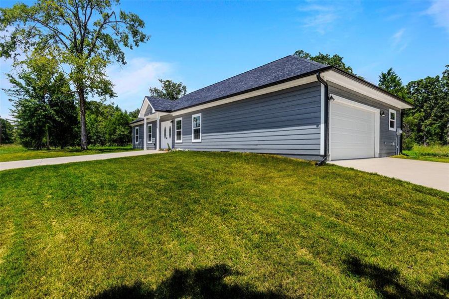 Front exterior of a new home in , Log Cabin, TX, highlighting curb appeal (Image 16).