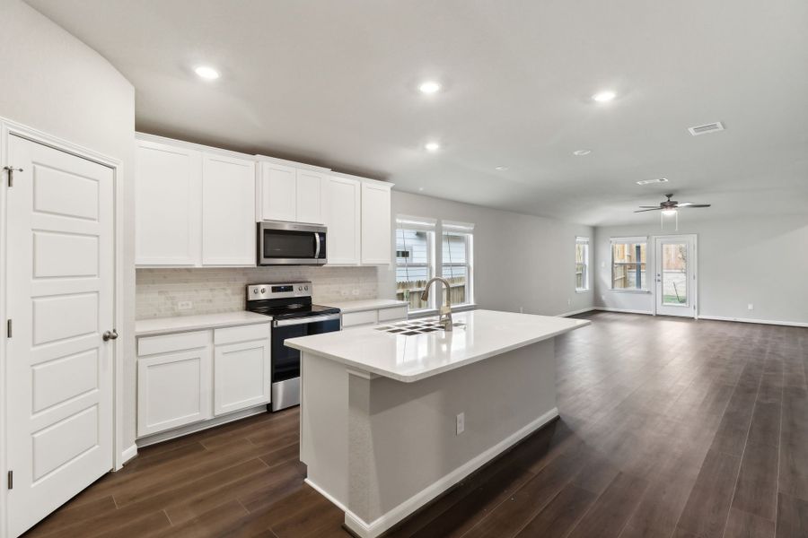 Kitchen in the Hughes floorplan at a Meritage Homes community.