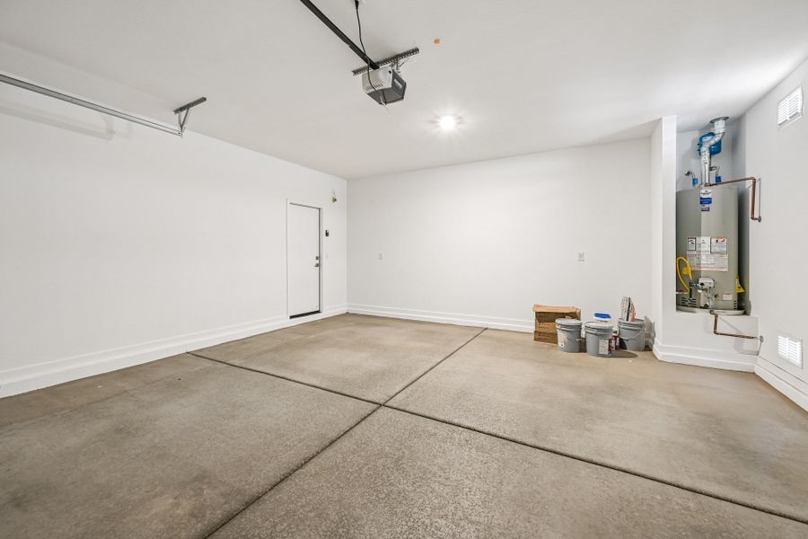 A room with white walls and a tile floor.