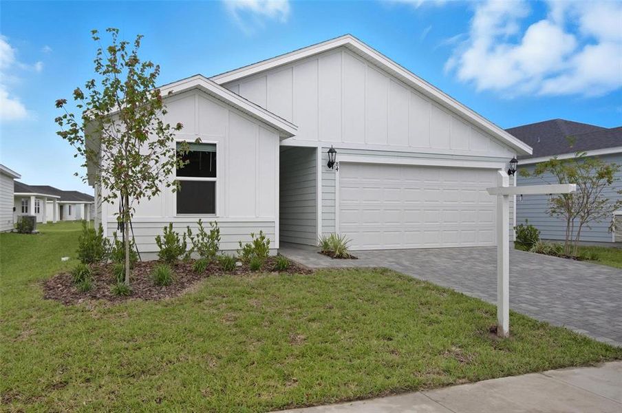 Front exterior of a new home in , Palm Coast, FL, highlighting curb appeal (Image 1). Front exterior of a new home in , Palm Coast, FL, highlighting curb appeal (Image 1).