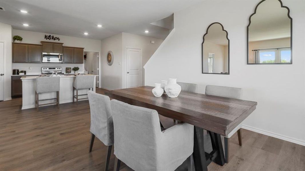 Dining room featuring recessed lighting and dark wood-type flooring