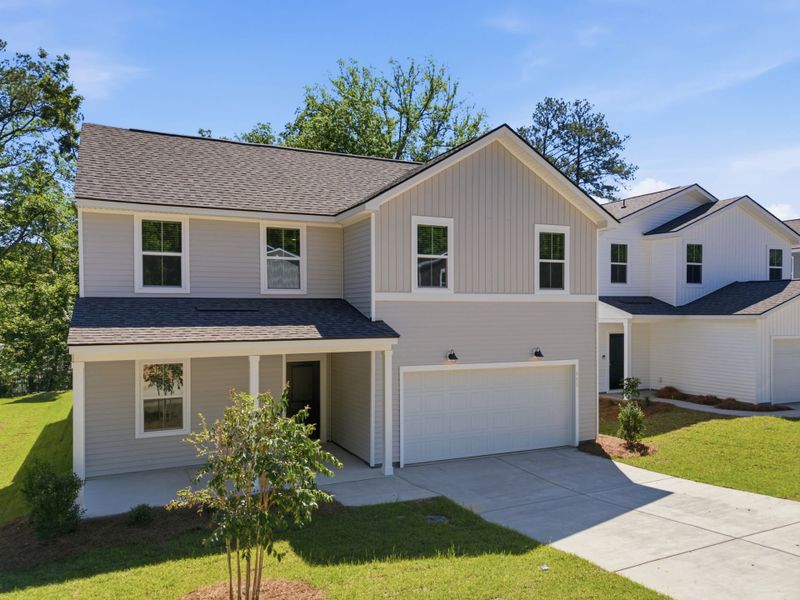 Front exterior of a new home in Grand Arbor, Blythewood, SC, highlighting curb appeal (Image 18). Front exterior of a new home in Grand Arbor, Blythewood, SC, highlighting curb appeal (Image 18).