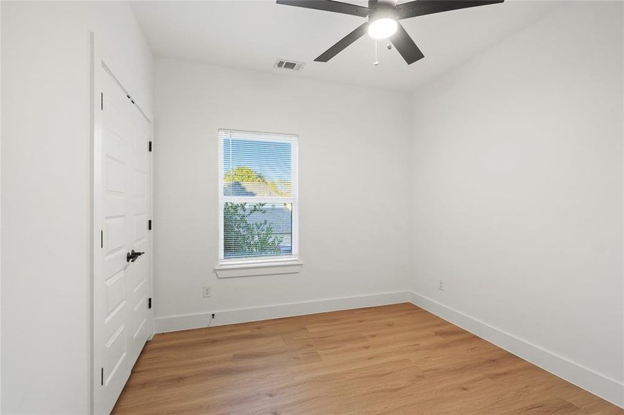 Unfurnished room featuring ceiling fan and light hardwood / wood-style floors