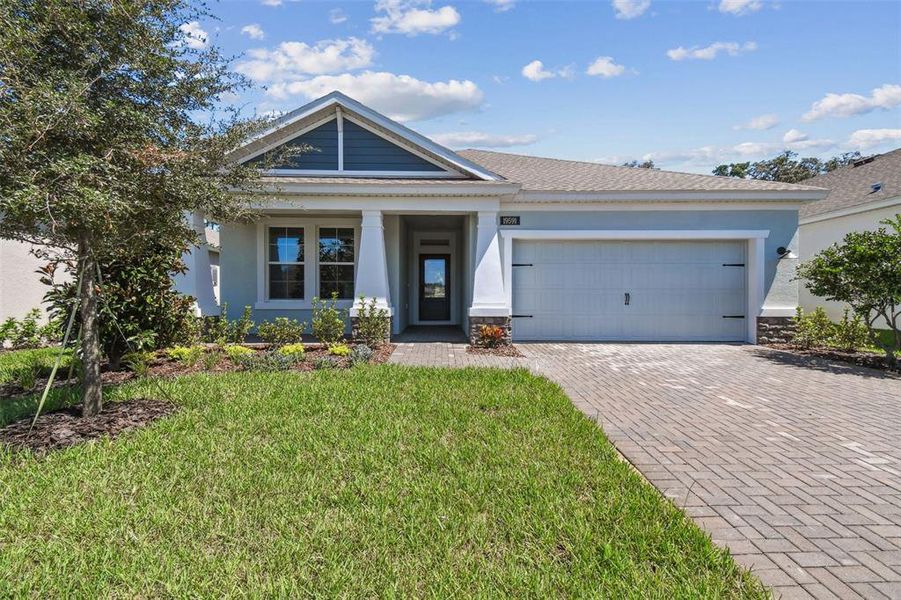 Front exterior of a new home in Cascades at Southern Hills, Brooksville, FL, highlighting curb appeal (Image 25).