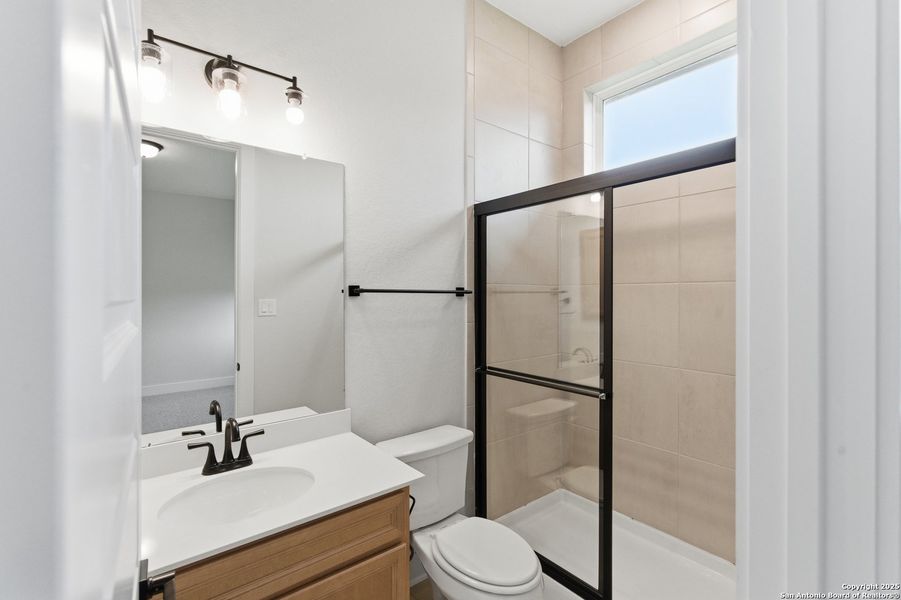 Furnished interior view inside a new home in Potranco Oaks, Castroville (Image 16).