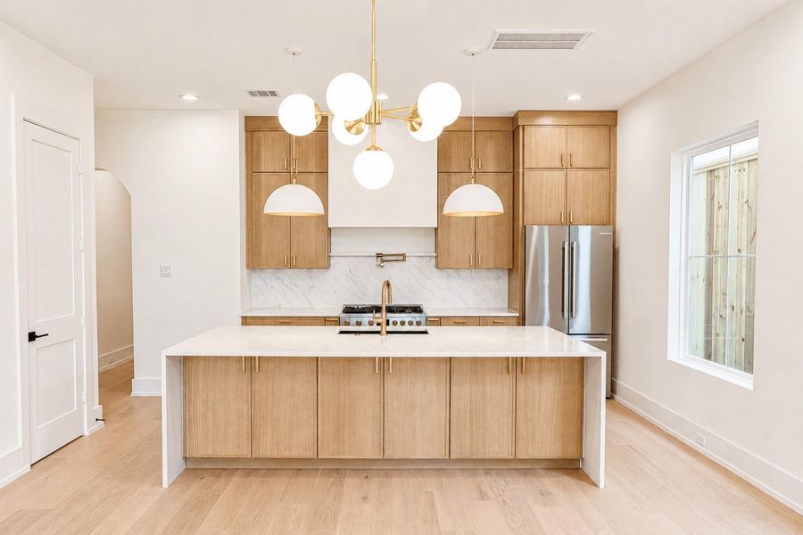 Kitchen with quartz countertop waterfall island Kitchen with quartz countertop waterfall island