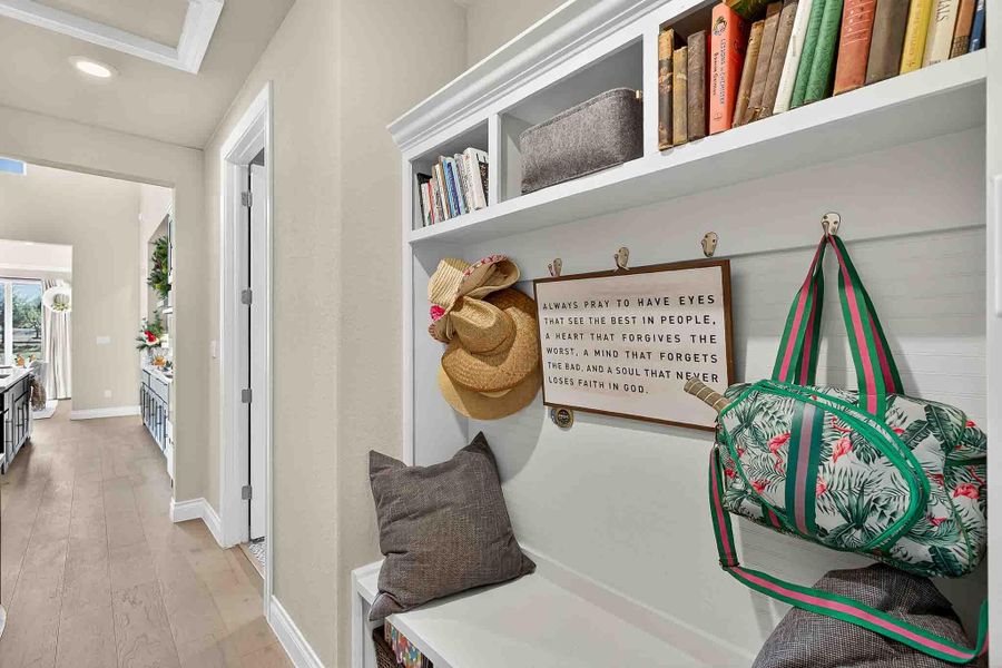 Mudroom with wood-type flooring and recessed lighting