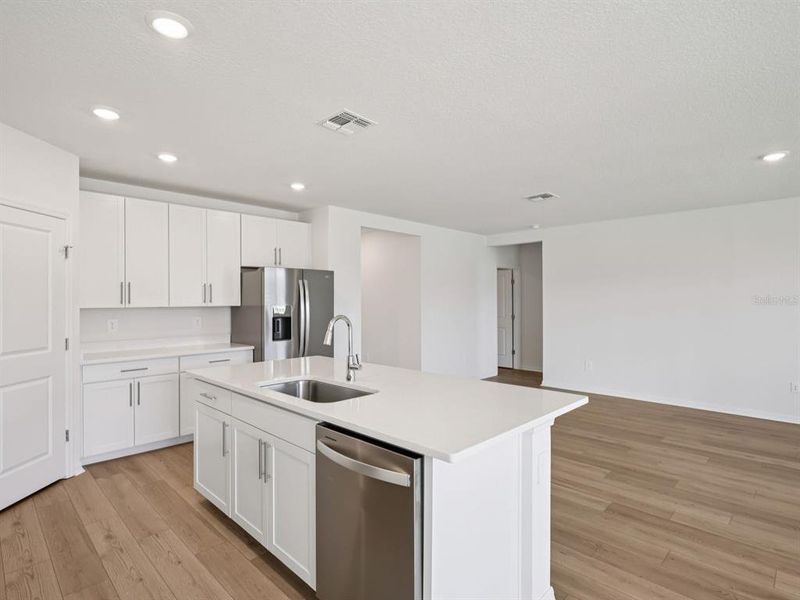 Furnished interior view inside a new home in The Grove at Stuart Crossing - Classic Series, Bartow (Image 8). Furnished interior view inside a new home in The Grove at Stuart Crossing - Classic Series, Bartow (Image 8).