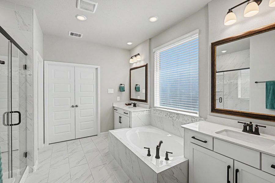 The tile flooring complements the cabinetry and countertops, bringing the space together. The tile flooring complements the cabinetry and countertops, bringing the space together.