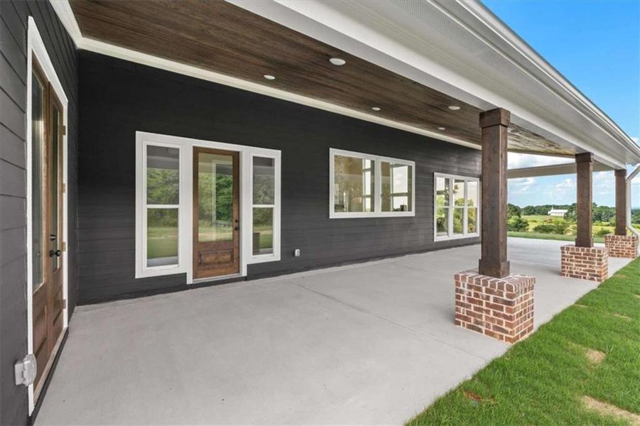 Exterior details and patio area of a home in , Roopville (Image 4).