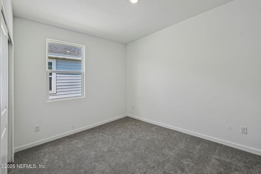 Spacious, unfurnished interior of a new home in Lakes at Bella Lago - Signature Series, Green Cove Springs (Image 27).