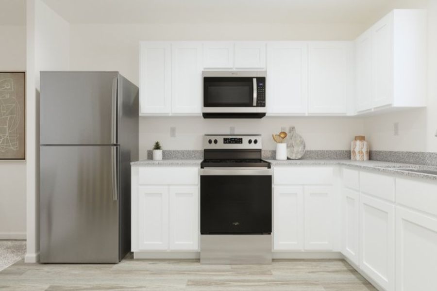 A kitchen with white cabinets. A kitchen with white cabinets.