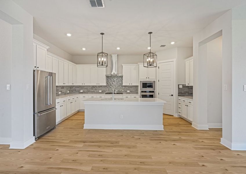 The kitchen has beautiful white wood cabinetry. The kitchen has beautiful white wood cabinetry.