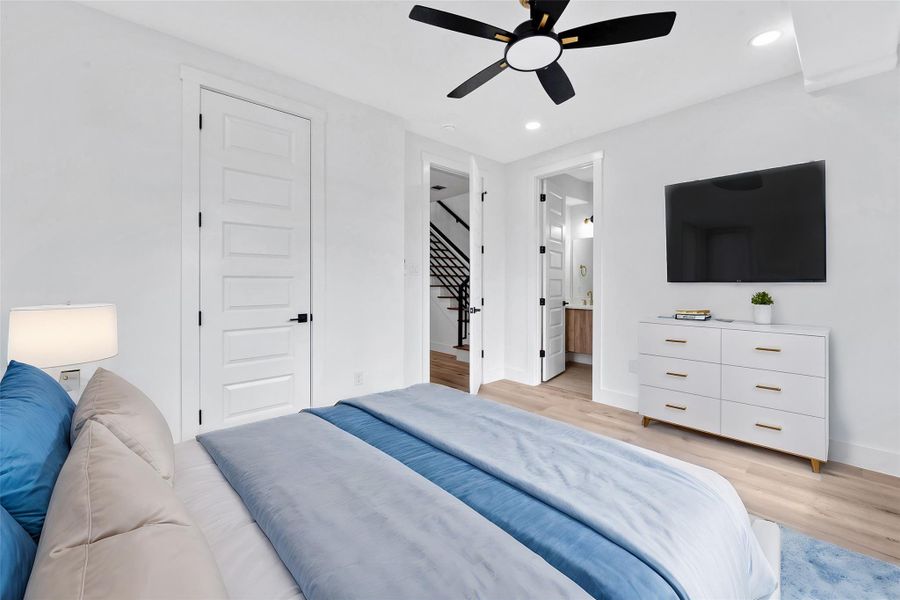 One of three bedrooms on the first floor. The door on the right leads to an ensuite bathroom. The door on the left is the bedroom closet.