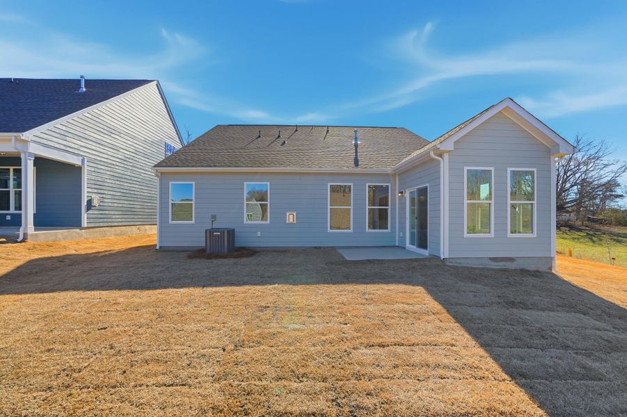 Exterior details and patio area of a home in Villas at Prestwick, Mooresville (Image 33).