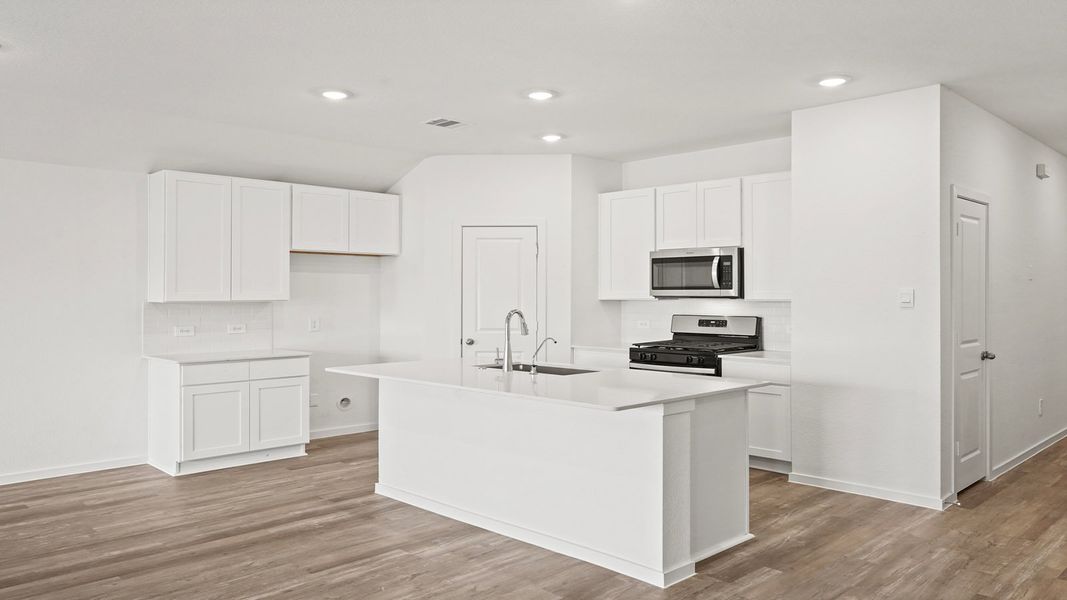 Furnished interior view inside a new home in Sunterra, Katy (Image 7).