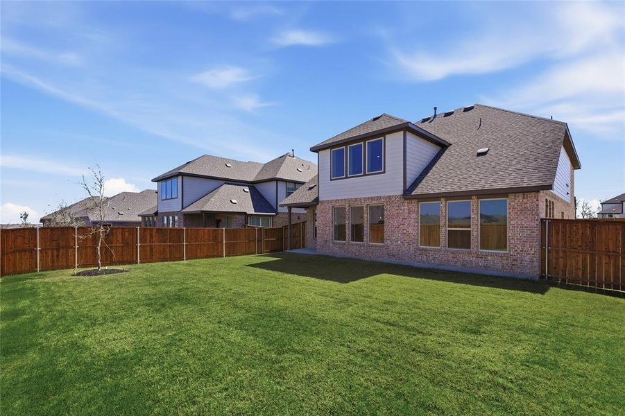 Expansive backyard with a manicured lawn
