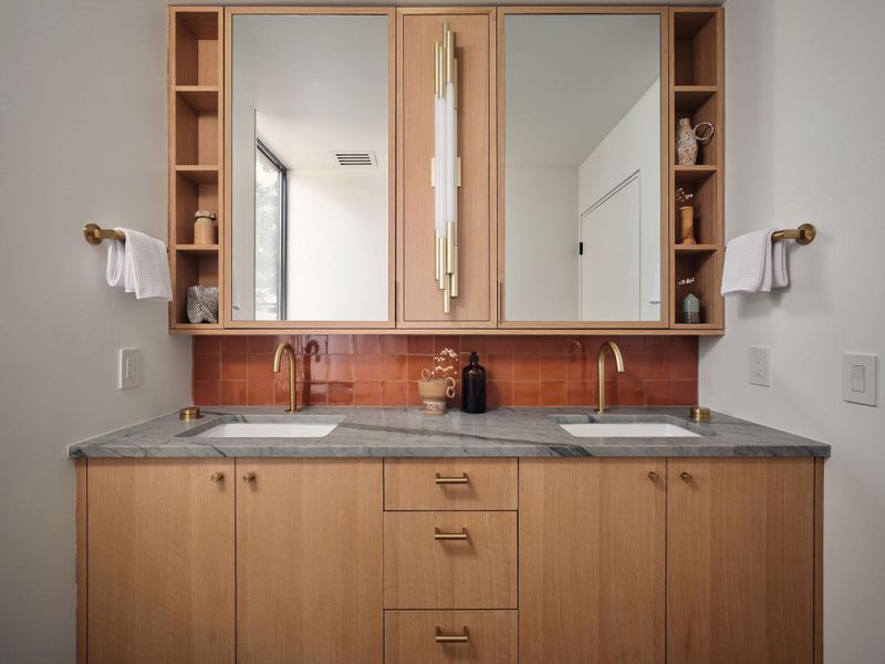 Full bathroom featuring backsplash and double vanity