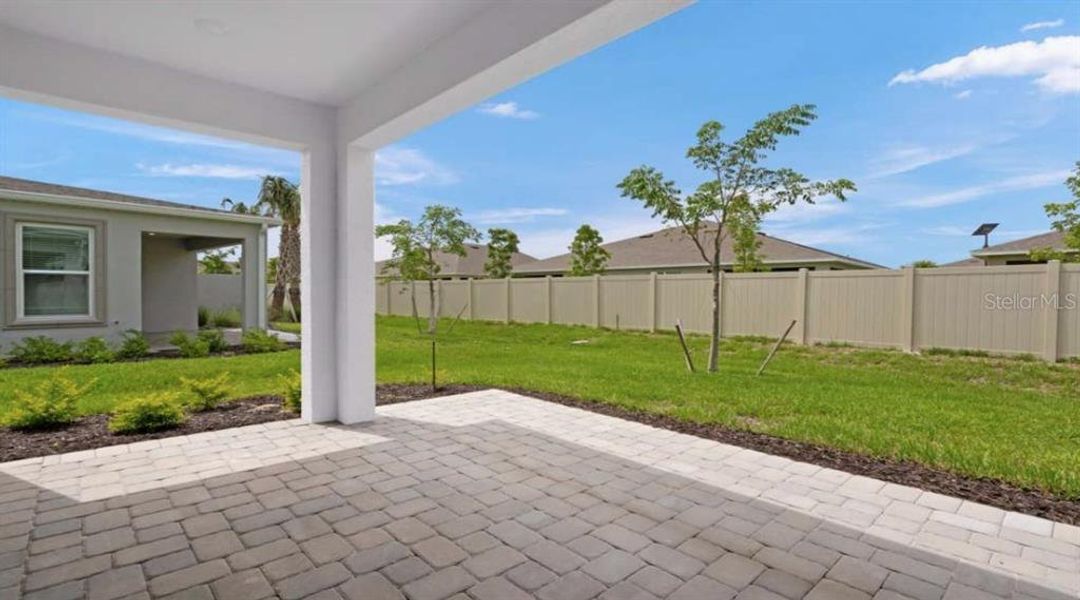Exterior details and patio area of a home in The Cove at West Port, Port Charlotte (Image 18).