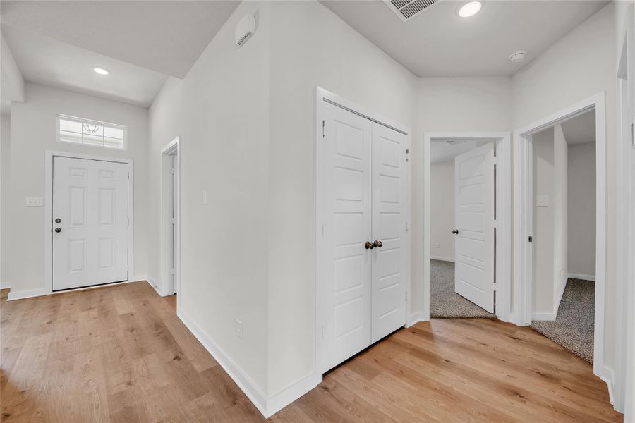 Entrance foyer featuring light wood-type flooring and recessed lighting Entrance foyer featuring light wood-type flooring and recessed lighting
