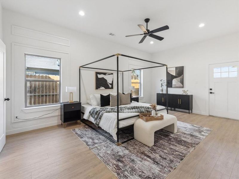 Bedroom featuring light wood-style flooring, visible vents, baseboards, and recessed lighting