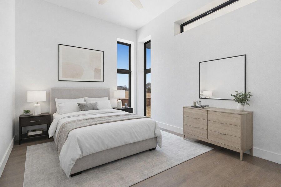 Bedroom with wood finished floors and a ceiling fan