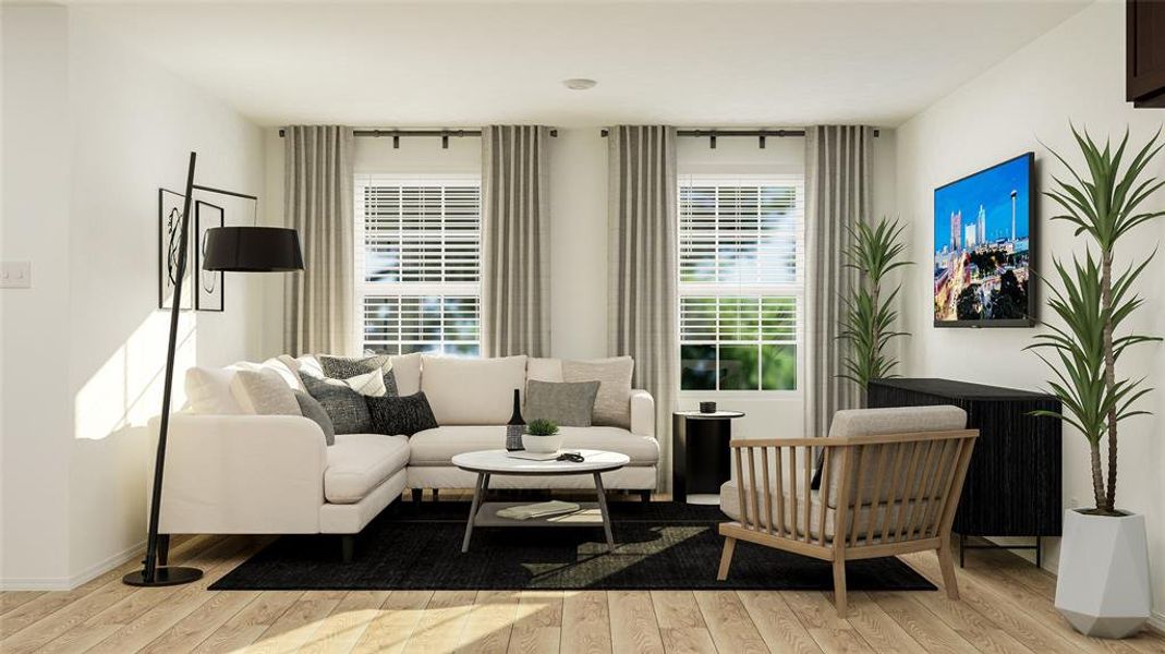 Living room with a wealth of natural light and wood-type flooring