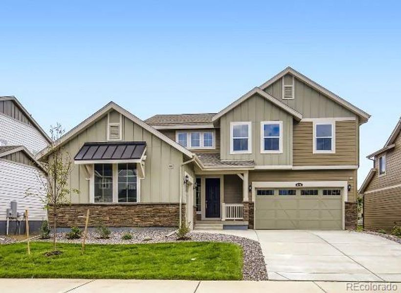 Front exterior of a new home in Riano Ridge: The Grand Collection, Loveland, CO, highlighting curb appeal (Image 1). Front exterior of a new home in Riano Ridge: The Grand Collection, Loveland, CO, highlighting curb appeal (Image 1).