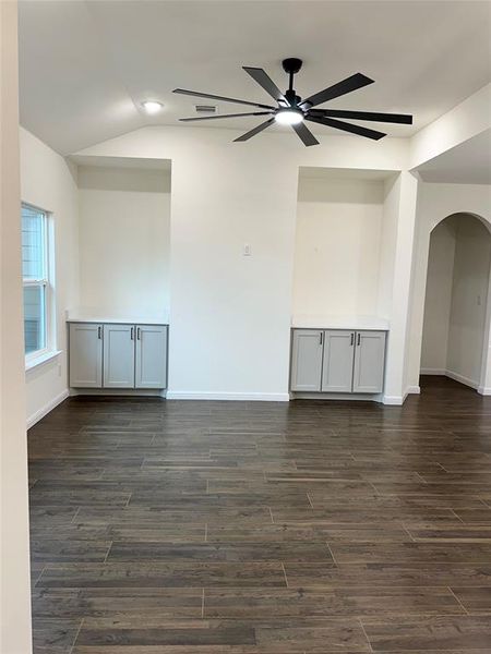 Spare room with lofted ceiling and ceiling fan