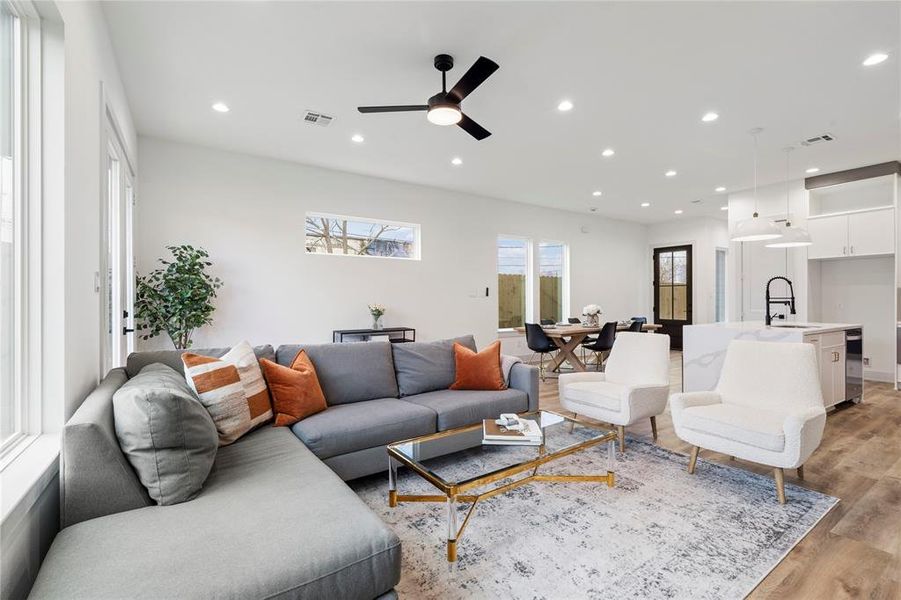 The space seamlessly connects to the dining area and kitchen, creating a perfect flow for entertaining