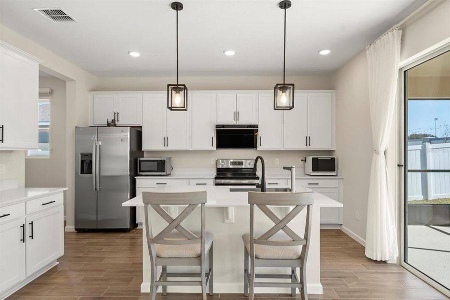 Furnished interior view inside a new home in Seasons at Lakeside Forest, Tavares (Image 17).