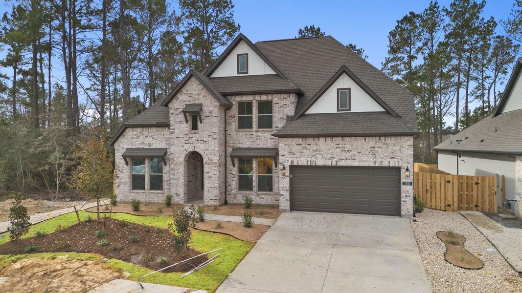 Front exterior of a new home in Colton, Montgomery, TX, highlighting curb appeal (Image 22).