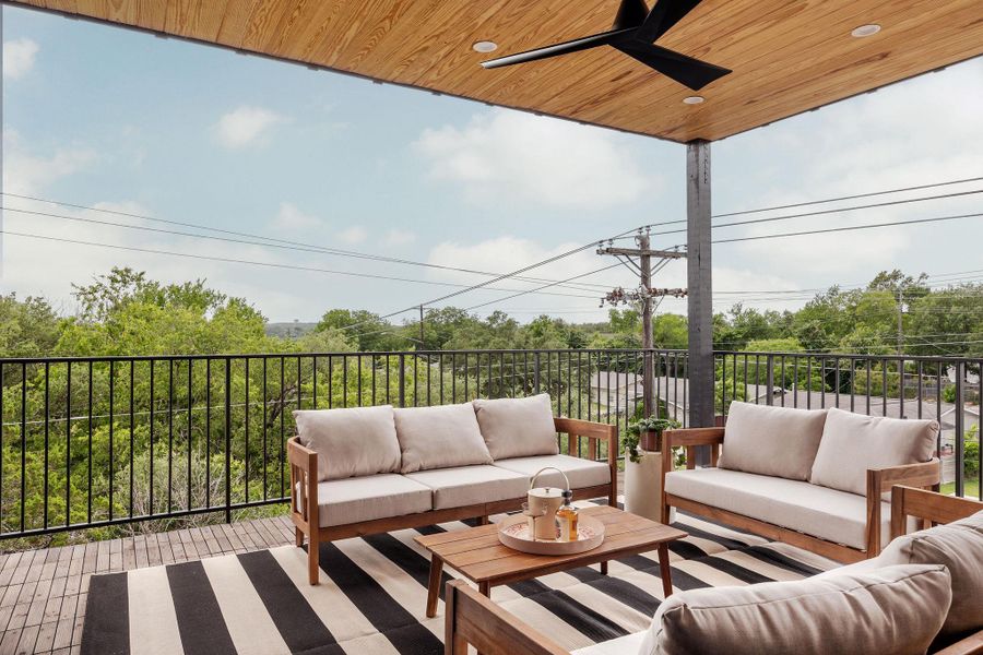 Wooden terrace with an outdoor living space and a ceiling fan Wooden terrace with an outdoor living space and a ceiling fan