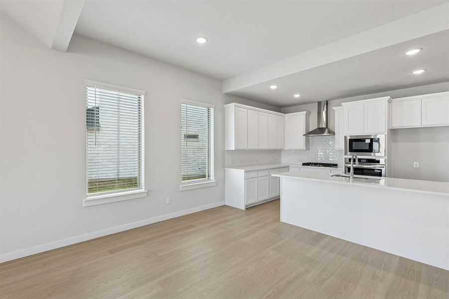 Kitchen in the Stanley II home plan by Trophy Signature Homes – REPRESENTATIVE PHOTO