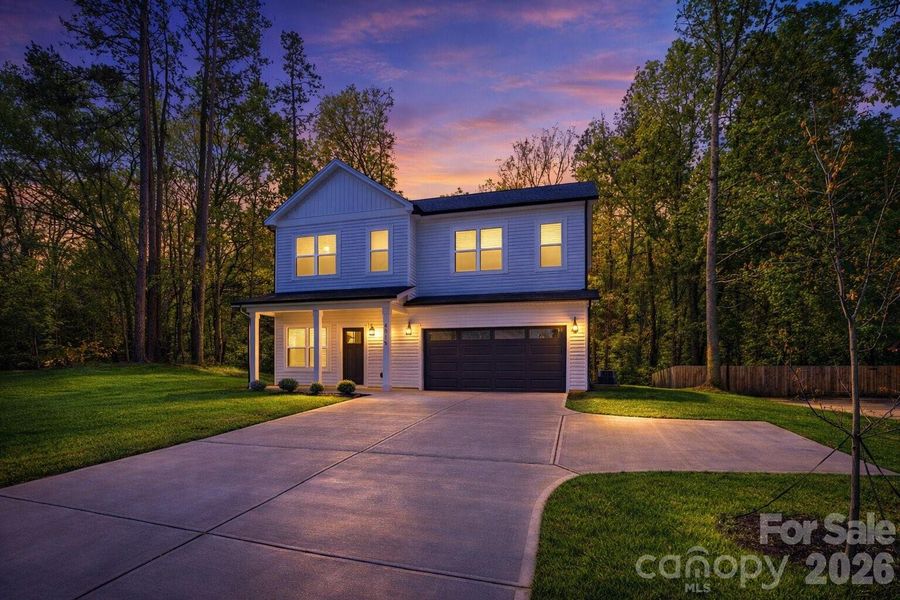 Front exterior of a new home in , Charlotte, NC, highlighting curb appeal (Image 25).